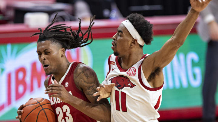 NCAA Basketball John Petty Jr. Alabama Crimson Tide Jalen Tate Arkansas Razorbacks (Photo by Wesley Hitt/Getty Images)