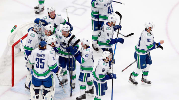 EDMONTON, ALBERTA - AUGUST 19: The Vancouver Canucks celebrate their 4-3 victory over the St. Louis Blues in Game Five of the Western Conference First Round during the 2020 NHL Stanley Cup Playoffs at Rogers Place on August 19, 2020 in Edmonton, Alberta, Canada. The Canucks defeated the Blues 4-3. (Photo by Jeff Vinnick/Getty Images)