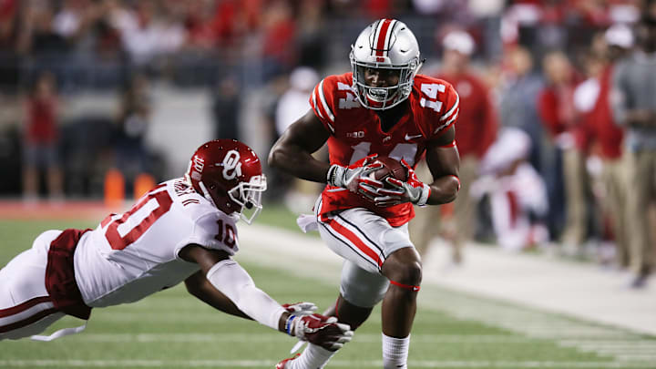 COLUMBUS, OH – SEPTEMBER 09: Steven Parker #10 of the Oklahoma Sooners attempt to tackle K.J. Hill #14 of the Ohio State Buckeyes during the first half at Ohio Stadium on September 9, 2017, in Columbus, Ohio. (Photo by Gregory Shamus/Getty Images)