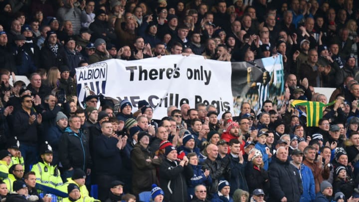 LIVERPOOL, ENGLAND - JANUARY 20: Fans hold up tribute banner for Cyrille Regis who passed away earlier this week during the Premier League match between Everton and West Bromwich Albion at Goodison Park on January 20, 2018 in Liverpool, England. (Photo by Tony Marshall/Getty Images)