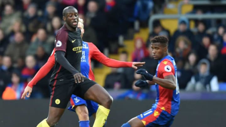 Manchester City’s Ivorian midfielder Yaya Toure (L) passes the ball as Crystal Palace’s Ivorian-born English striker Wilfried Zaha (R) tries to close him down during the English Premier League football match between Crystal Palace and Manchester City at Selhurst Park in south London on November 19, 2016. / AFP / OLLY GREENWOOD / RESTRICTED TO EDITORIAL USE. No use with unauthorized audio, video, data, fixture lists, club/league logos or ‘live’ services. Online in-match use limited to 75 images, no video emulation. No use in betting, games or single club/league/player publications. / (Photo credit should read OLLY GREENWOOD/AFP/Getty Images)