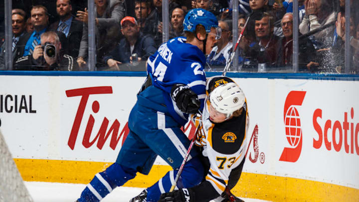 TORONTO, ON - APRIL 23: Kasperi Kapanen #24 of the Toronto Maple Leafs checks Charlie McAvoy #73 of the Boston Bruins in Game Six of the Eastern Conference First Round during the 2018 NHL Stanley Cup Playoffs at the Air Canada Centre on April 23, 2018 in Toronto, Ontario, Canada. (Photo by Mark Blinch/NHLI via Getty Images)