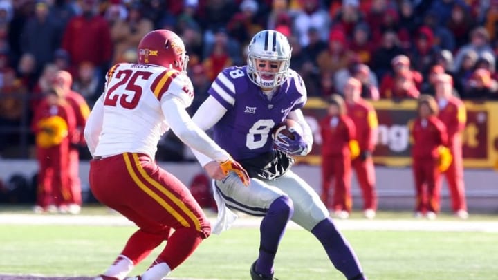 Nov 21, 2015; Manhattan, KS, USA; Kansas State Wildcats quarterback Joe Hubener (8) looks for room to run against Iowa State Cyclones linebacker Brian Mills (25) at Bill Snyder Family Football Stadium. The Wildcats won the game 38-35. Mandatory Credit: Scott Sewell-USA TODAY Sports