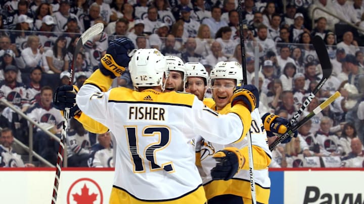 WINNIPEG, MB – MAY 3: Mike Fisher #12, Ryan Hartman #38, Yannick Weber #7 and Miikka Salomaki #20 of the Nashville Predators celebrate a first period goal against the Winnipeg Jets in Game Four of the Western Conference Second Round during the 2018 NHL Stanley Cup Playoffs at the Bell MTS Place on May 3, 2018 in Winnipeg, Manitoba, Canada. (Photo by Jonathan Kozub/NHLI via Getty Images)