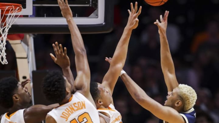KNOXVILLE, TN - NOVEMBER 13: Brandon Alston #4 of the Georgia Tech Yellow Jackets shoots the ball with Kyle Alexander #11, Jalen Johnson #13 and Grant Williams #2 of the Tennessee Volunteers defending at Thompson-Boling Arena on November 13, 2018 in Knoxville, Tennessee. (Photo by Donald Page/Getty Images)