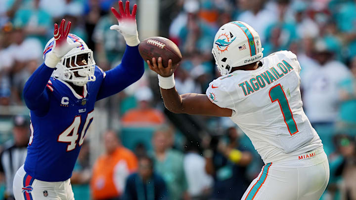 MIAMI GARDENS, FLORIDA – SEPTEMBER 25: Tua Tagovailoa #1 of the Miami Dolphins passes the ball against Von Miller #40 of the Buffalo Bills during the fourth quarter at Hard Rock Stadium on September 25, 2022 in Miami Gardens, Florida. (Photo by Eric Espada/Getty Images)