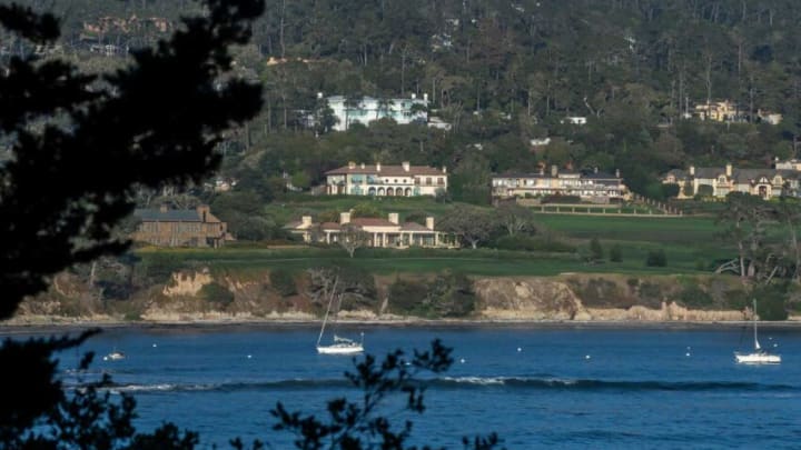 Two boats sail next to the Pebble Beach Golf Links that is homes to some of the most expensive homes in Monterey County in Pebble Beach, Calif., on Tuesday, Sept. 28, 2021.