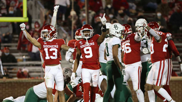 Dec 5, 2020; Norman, Oklahoma, USA; Oklahoma Sooners defensive back Tre Norwood (13) and cornerback D.J. Graham (9) react during the first half against the Baylor Bears at Gaylord Family-Oklahoma Memorial Stadium. Mandatory Credit: Kevin Jairaj-USA TODAY Sports