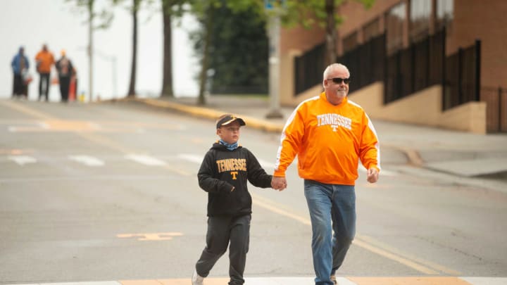 Tennessee football fans John and Josh Baumman, 7, make their way to the Orange and White game on Saturday, April 24, 2021.Kns Vols Pre Spring Game