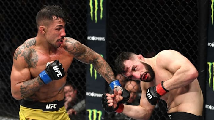 MILWAUKEE, WISCONSIN - DECEMBER 15: (L-R) Joaquim Silva of Brazil punches Jared Gordon in their lightweight bout during the UFC Fight Night event at Fiserv Forum on December 15, 2018 in Milwaukee, Wisconsin. (Photo by Jeff Bottari/Zuffa LLC/Zuffa LLC via Getty Images)