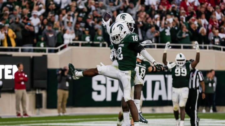 Michigan State's Kalon Gervin (18) celebrates safety Michael Dowell's touchdown on the final play of the 40-31 win against Indiana at Spartan Stadium in East Lansing, Saturday, Sept. 28, 2019.Michigan State celebrates, Kalon Gervin
