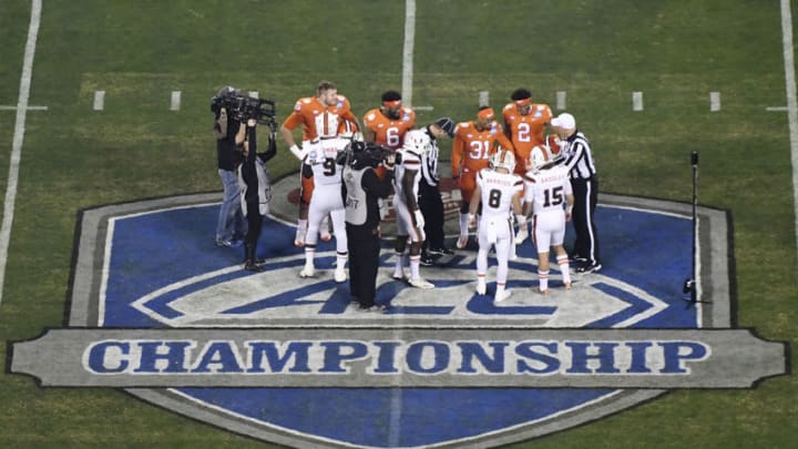 CHARLOTTE, NC - DECEMBER 02: The Clemson Tigers and Miami Hurricanes participate in the coin toss to start the ACC Football Championship at Bank of America Stadium on December 2, 2017 in Charlotte, North Carolina. (Photo by Mike Comer/Getty Images)