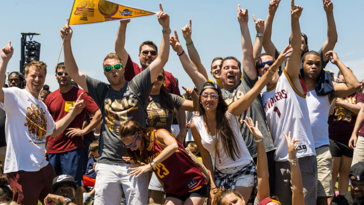 CLEVELAND, OH - JUNE 22: Cleveland fans celebrate during the Cleveland Cavaliers 2016 NBA Championship victory parade and rally on June 22, 2016 in Cleveland, Ohio. The Cavaliers defeated the Golden State Warriors to bring the first professional sports championship to the city of Cleveland since 1964. (Photo by Angelo Merendino/Getty Images)