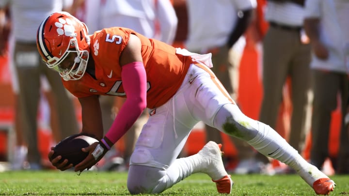 CLEMSON, SOUTH CAROLINA – OCTOBER 22: DJ Uiagalelei #5 of the Clemson Tigers recovers his fumble against the Syracuse Orange in the second quarter at Memorial Stadium on October 22, 2022 in Clemson, South Carolina. (Photo by Eakin Howard/Getty Images)
