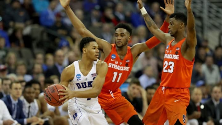 OMAHA, NE - MARCH 23: Oshae Brissett #11 and Frank Howard #23 of the Syracuse Orange defend Trevon Duval #1 of the Duke Blue Devils during the second half in the 2018 NCAA Men's Basketball Tournament Midwest Regional at CenturyLink Center on March 23, 2018 in Omaha, Nebraska. (Photo by Streeter Lecka/Getty Images)