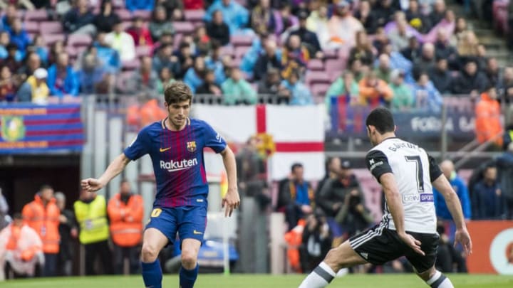 BARCELONA, SPAIN - APRIL 14: Sergi Roberto Carnicer of FC Barcelona is tackled by GonCalo Manuel Ganchinho Guedes of Valencia CF during the La Liga match between Barcelona and Valencia at Camp Nou on April 14, 2018 in Barcelona, Spain. (Photo by Power Sport Images/Getty Images)