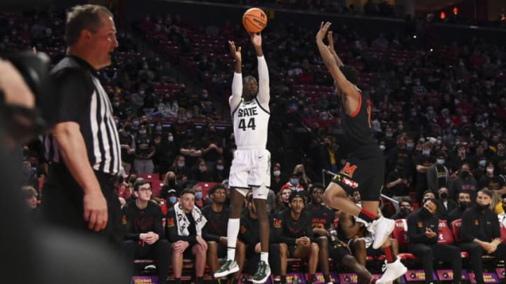 Feb 1, 2022; College Park, Maryland, USA; Michigan State Spartans forward Gabe Brown (44) shoots a three point basket overt Maryland Terrapins guard Xavier Green (11) during the first half at Xfinity Center. Mandatory Credit: Tommy Gilligan-USA TODAY Sports