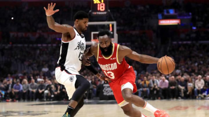 LOS ANGELES, CALIFORNIA – NOVEMBER 22: James Harden #13 of the Houston Rockets dribbles past Paul George #13 of the Los Angeles Clippers during the first half of a game at Staples Center on November 22, 2019, in Los Angeles, California. NOTE TO USER: User expressly acknowledges and agrees that, by downloading and/or using this photograph, user is consenting to the terms and conditions of the Getty Images License Agreement (Photo by Sean M. Haffey/Getty Images)