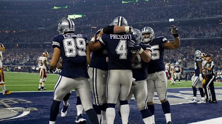 Nov 24, 2016; Arlington, TX, USA; Dallas Cowboys quarterback Dak Prescott (4) celebrates a touchdown against the Washington Redskins during the second half at AT&T Stadium. Mandatory Credit: Jerome Miron-USA TODAY Sports