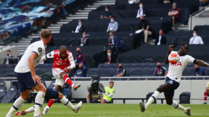 LONDON, ENGLAND – JULY 12: Alexandre Lacazette of Arsenal scores his sides first goal during the Premier League match between Tottenham Hotspur and Arsenal FC at Tottenham Hotspur Stadium on July 12, 2020 in London, England. Football Stadiums around Europe remain empty due to the Coronavirus Pandemic as Government social distancing laws prohibit fans inside venues resulting in all fixtures being played behind closed doors. (Photo by Julian Finney/Getty Images)