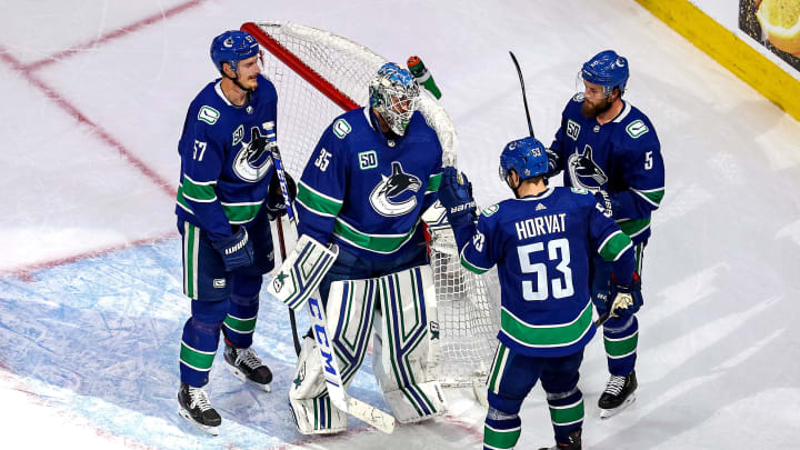 EDMONTON, ALBERTA – SEPTEMBER 03: Thatcher Demko #35 of the Vancouver Canucks is congratulated by his teammates after his 4-0 shutout victory against the Vegas Golden Knights in Game Six of the Western Conference Second Round during the 2020 NHL Stanley Cup Playoffs at Rogers Place on September 03, 2020 in Edmonton, Alberta, Canada. (Photo by Bruce Bennett/Getty Images)