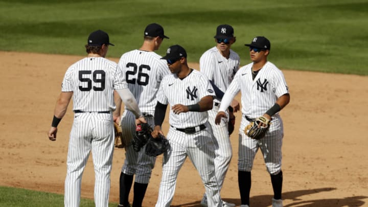 NEW YORK, NEW YORK - SEPTEMBER 13: (L-R) Luke Voit #59, DJ LeMahieu #26, Aaron Hicks #31, Tyler Wade #14 and Thairo Estrada #71 of the New York Yankees celebrate after defeating the Baltimore Orioles at Yankee Stadium on September 13, 2020 in New York City. (Photo by Jim McIsaac/Getty Images)