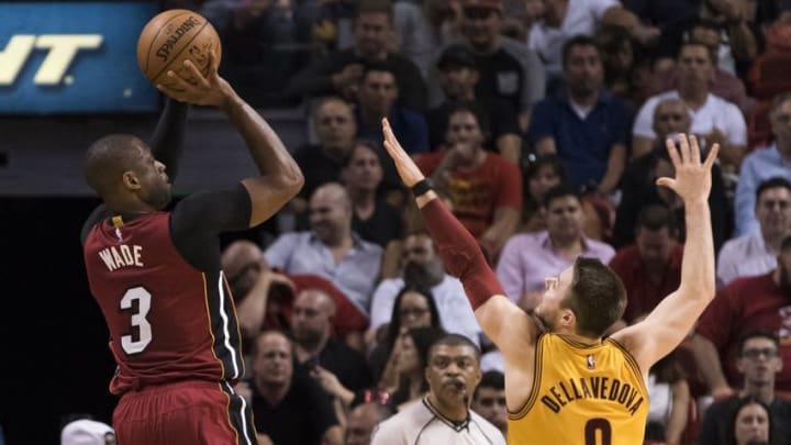 Mar 19, 2016; Miami, FL, USA; Miami Heat guard Dwyane Wade (3) shoots over Cleveland Cavaliers guard Matthew Dellavedova (8) during the second half at American Airlines Arena. The Heat won 122-101. Mandatory Credit: Steve Mitchell-USA TODAY Sports