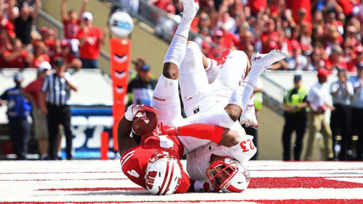 MADISON, WI - SEPTEMBER 08: A.J. Taylor #4 of the Wisconsin Badgers catches a pass for a touchdown in front of Marcus Hayes #23 of the New Mexico Lobos during the second half of a game at Camp Randall Stadium on September 8, 2018 in Madison, Wisconsin. (Photo by Stacy Revere/Getty Images)