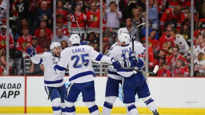 Jun 8, 2015; Chicago, IL, USA; Tampa Bay Lightning left wing Ondrej Palat (18) celebrates with teammates after scoring a goal against the Chicago Blackhawks in the third period in game three of the 2015 Stanley Cup Final at United Center. Mandatory Credit: Dennis Wierzbicki-USA TODAY Sports