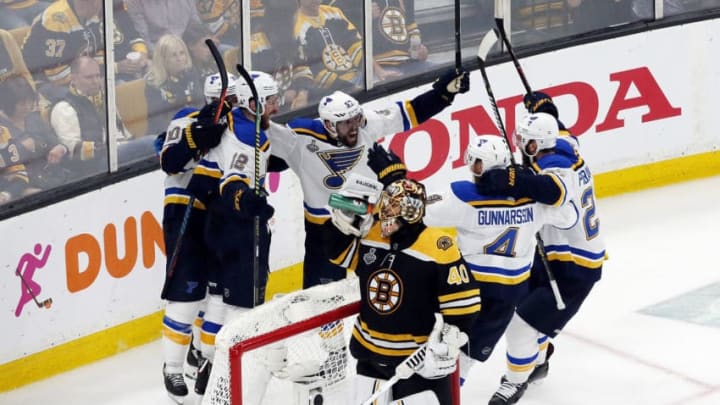 BOSTON, MASSACHUSETTS - JUNE 12: Zach Sanford #12 of the St. Louis Blues is congratulated by his teammates after scoring a third period goal as Tuukka Rask #40 of the Boston Bruins reacts in Game Seven of the 2019 NHL Stanley Cup Final at TD Garden on June 12, 2019 in Boston, Massachusetts. (Photo by Rich Gagnon/Getty Images)
