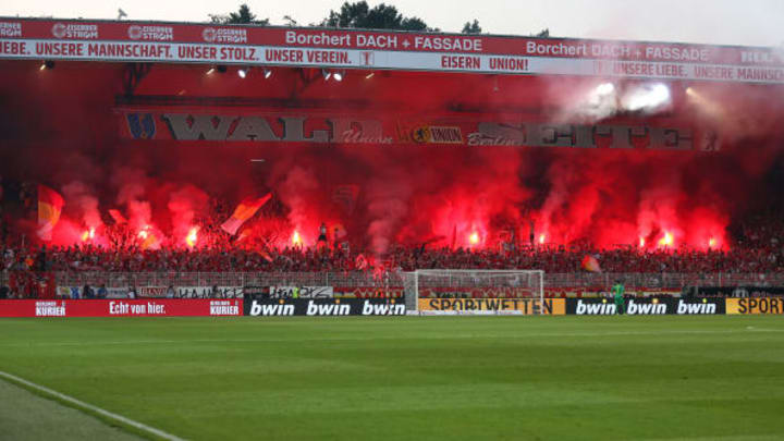 31 August 2019, Berlin: Soccer: Bundesliga, 1st FC Union Berlin – Borussia Dortmund, 3rd matchday, stadium An der Alten Försterei. Union fans ignite Bengali fire in fan block forest side. Photo: Andreas Gora/dpa