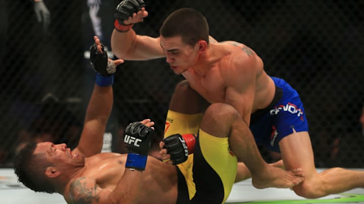 ATLANTA, GA - JULY 30: (R-L) Ryan Benoit punches Fredy Serrano of Columbia in their flyweight bout during the UFC 201 event on July 30, 2016 at Philips Arena in Atlanta, Georgia. (Photo by Daniel Shirey/Zuffa LLC/Zuffa LLC via Getty Images)
