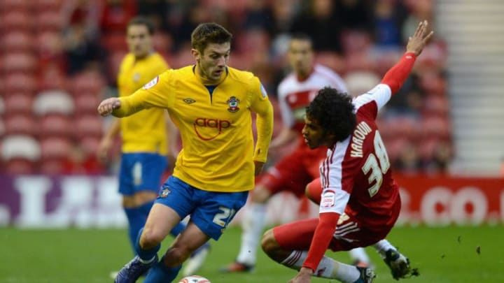 MIDDLESBROUGH, ENGLAND - APRIL 21: Adam Lallana of Southampton gets past Faris Haroun of Middlesborough during the npower Championship between Middlesbrough and Southampton at Riverside Stadium on April 21, 2012 in Middlesbrough, England. (Photo by Gareth Copley/Getty Images)