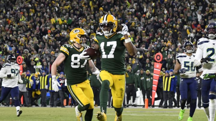 GREEN BAY, WISCONSIN - JANUARY 12: Davante Adams #17 of the Green Bay Packers runs in a 40-yard touchdown catch against the Seattle Seahawks in the third quarter of the NFC Divisional Playoff game at Lambeau Field on January 12, 2020 in Green Bay, Wisconsin. (Photo by Quinn Harris/Getty Images)