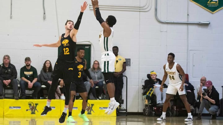 Vermont’s Stef Smith (0) shoots a 3-pointer over UMBC’s Brandon Horvath Umbc Vs Vermont Men S Basketball 2 22 20