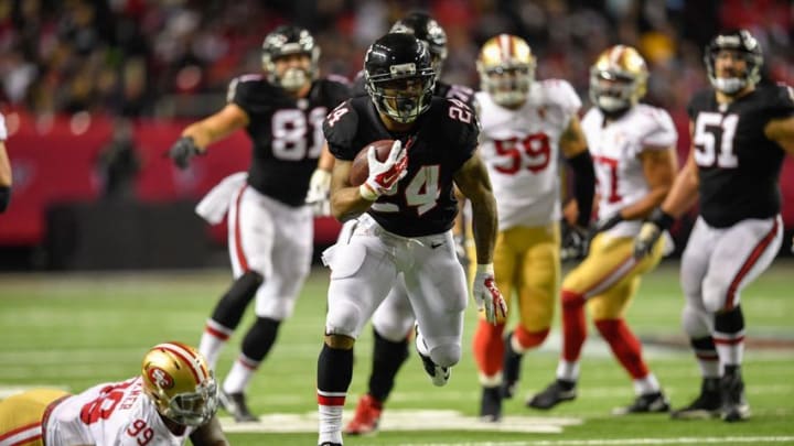 Dec 18, 2016; Atlanta, GA, USA; Atlanta Falcons running back Devonta Freeman (24) runs against the San Francisco 49ers during the first half at the Georgia Dome. Mandatory Credit: Dale Zanine-USA TODAY Sports