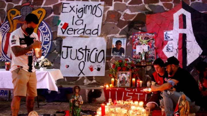 Soccer fans in Guadalajara set up a memorial outside Jalisco Stadium as part of a protest against the extreme violence at a Liga MX soccer match last weekend. (Photo by ULISES RUIZ/AFP via Getty Images)