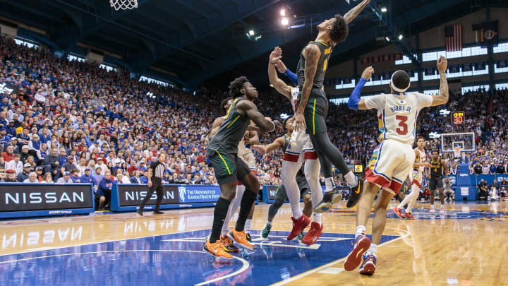 Feb 18, 2023; Lawrence, Kansas, USA; Baylor Bears forward Jalen Bridges (11) grabs a rebound during the first half against the Kansas Jayhawks at Allen Fieldhouse. Mandatory Credit: William Purnell-USA TODAY Sports