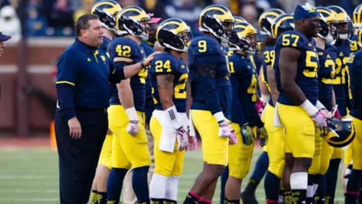 Nov 1, 2014; Ann Arbor, MI, USA; Michigan Wolverines head coach Brady Hoke (left) during the game against the Indiana Hoosiers at Michigan Stadium. Mandatory Credit: Rick Osentoski-USA TODAY Sports Nov 1, 2014; Ann Arbor, MI, USA; Michigan Wolverines head coach Brady Hoke (left) during the game against the Indiana Hoosiers at Michigan Stadium. Mandatory Credit: Rick Osentoski-USA TODAY Sports