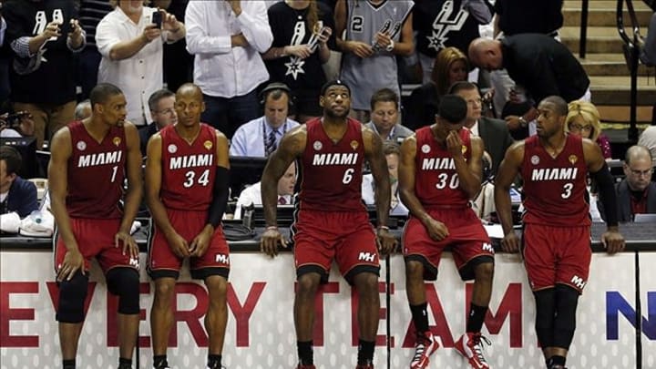 Jun 11, 2013; San Antonio, TX, USA; Miami Heat center Chris Bosh (1), Ray Allen (34), LeBron James (6), Norris Cole (30) and Dwyane Wade (3) react during a time-out against the San Antonio Spurs in the fourth quarter during game three of the 2013 NBA Finals at the AT