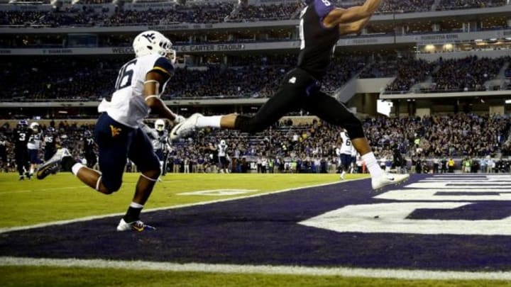 Oct 29, 2015; Fort Worth, TX, USA; TCU Horned Frogs wide receiver Josh Doctson (9) catches a touchdown pass past West Virginia Mountaineers cornerback Terrell Chestnut (16) during the first quarter at Amon G. Carter Stadium. Mandatory Credit: Kevin Jairaj-USA TODAY Sports