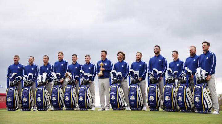 KOHLER, WISCONSIN - SEPTEMBER 21: (L-R) Lee Westwood of England and team Europe, Sergio Garcia of Spain and team Europe, Paul Casey of England and team Europe, Ian Poulter of England and team Europe, Rory McIlroy of Northern Ireland and team Europe, Matthew Fitzpatrick of England and team Europe, captain Padraig Harrington of Ireland and team Europe, Tommy Fleetwood of England and team Europe, Tyrrell Hatton of England and team Europe, Jon Rahm of Spain and team Europe, Viktor Hovland of Norway and team Europe, Shane Lowry of Ireland and team Europe and Bernd Wiesberger of Austria and team Europe pose for a team photo with their bags and the Ryder Cup prior to the 43rd Ryder Cup at Whistling Straits on September 21, 2021 in Kohler, Wisconsin. (Photo by Patrick Smith/Getty Images)