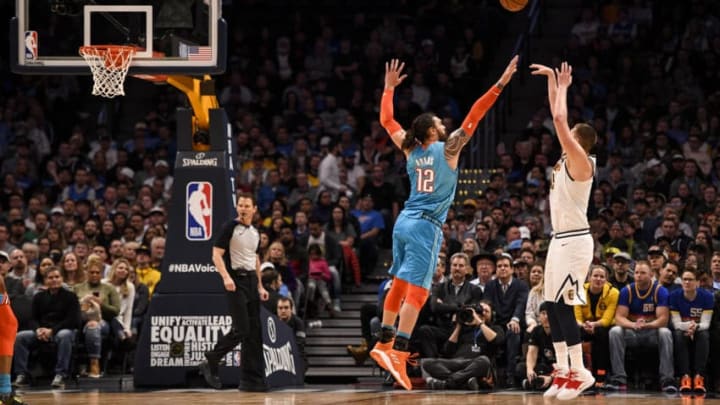 DENVER , CO - FEBRUARY 26: Nikola Jokic (15) of the Denver Nuggets jacks over Steven Adams (12) of the Oklahoma City Thunder during the third quarter on Tuesday, February 26, 2019. (Photo by AAron Ontiveroz/MediaNews Group/The Denver Post via Getty Images)