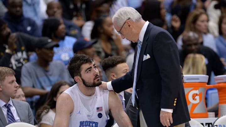CHAPEL HILL, NC - JANUARY 09: Head coach Roy Williams talks with Luke Maye