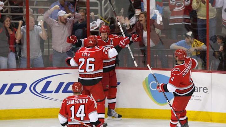 RALEIGH, NC - MAY 26: Eric Staal #12 and Erik Cole #26 of the Carolina Hurricanes celebrate against the Pittsburgh Penguins during Game Four of the Eastern Conference Championship Round of the 2009 Stanley Cup Playoffs at RBC Center on May 26, 2009 in Raleigh, North Carolina. (Photo by Kevin C. Cox/Getty Images)
