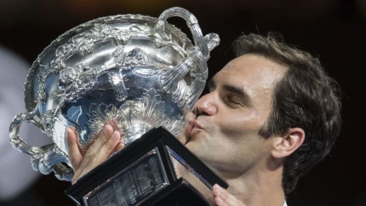 MELBOURNE, AUSTRALIA - JANUARY 28: Roger Federer of Switzerland with the men's singles trophy after defeating Marin Cilic of Croatia on day 14 of the 2018 Australian Open at Melbourne Park on January 28, 2018 in Melbourne, Australia. (Photo by James D. Morgan/Getty Images)