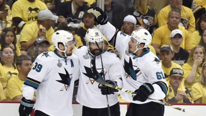 Jun 9, 2016; Pittsburgh, PA, USA; San Jose Sharks center Logan Couture (39) celebrates with center Patrick Marleau (12) and defenseman Justin Braun (61) after scoring a goal against the Pittsburgh Penguins in the first period in game five of the 2016 Stanley Cup Final at Consol Energy Center. Mandatory Credit: Charles LeClaire-USA TODAY Sports