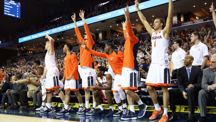 CHARLOTTESVILLE, VA – JANUARY 9: The Virginia Cavaliers bench cheers. (Photo by Ryan M. Kelly/Getty Images)