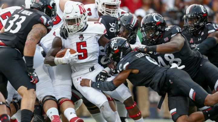 CINCINNATI, OH - AUGUST 31: Kentel Williams #5 of the Austin Peay Governors runs the ball as Linden Stephens #9 of the Cincinnati Bearcats makes the stop at Nippert Stadium on August 31, 2017 in Cincinnati, Ohio. (Photo by Michael Hickey/Getty Images)