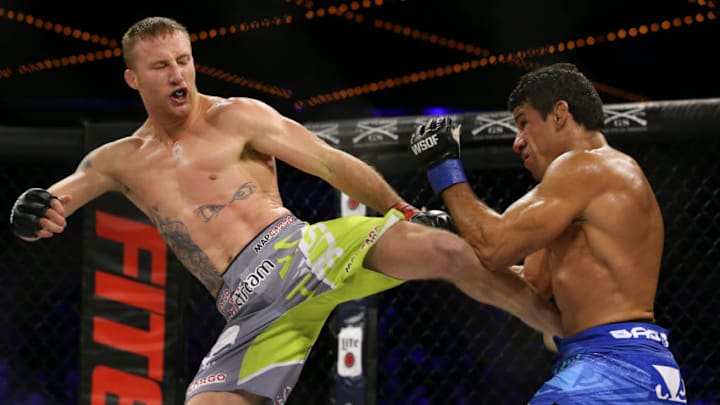 NEW YORK, NY - DECEMBER 31: Justin Gaethje (left) throws a kick to the body of challenger Luis Firmino () during their World Series of Fighting lightweight championship fight at The Theater at Madison Square Garden on December 31, 2016 in New York City. (Photo by Ed Mulholland/Getty Images)